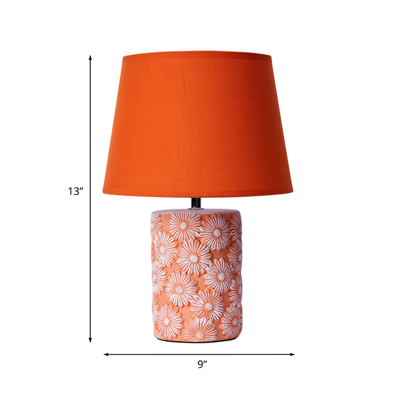 GloeiLieke - Orange tapered table lamp with carved sunflower base