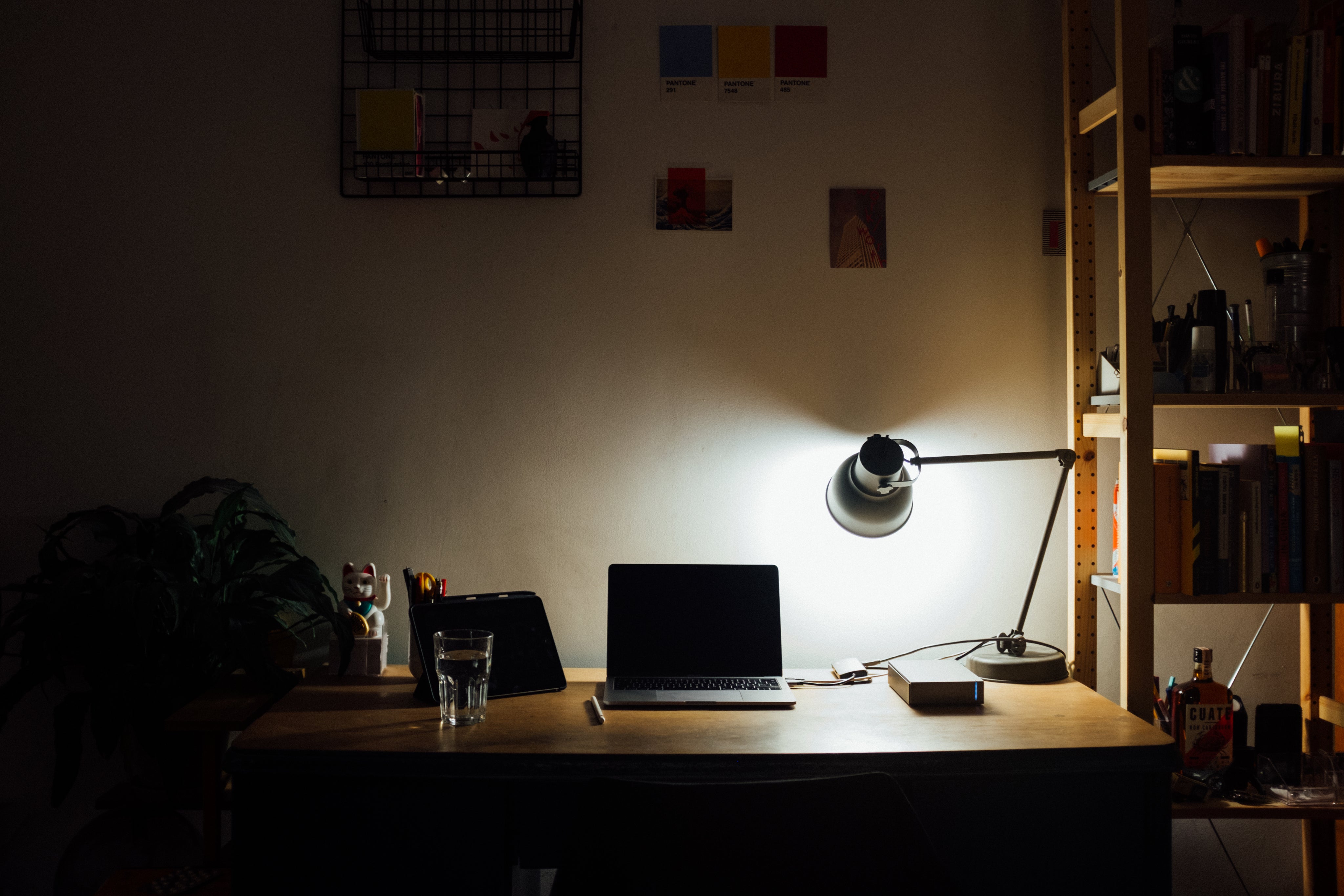 objects-on-a-desk-throw-shadows-from-a-lamp.jpg